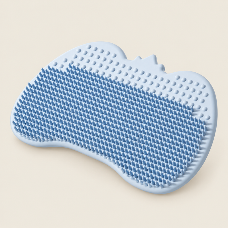 Baby Silicone Shampoo Brush For Bathing on warm neutral background