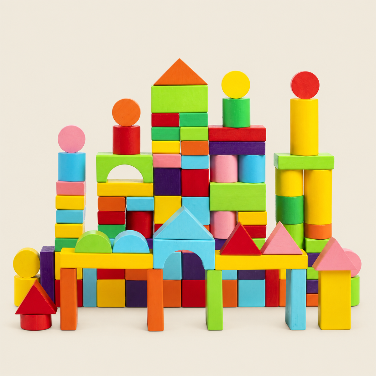 Colorful wooden blocks assembled into a castle on a warm cream background