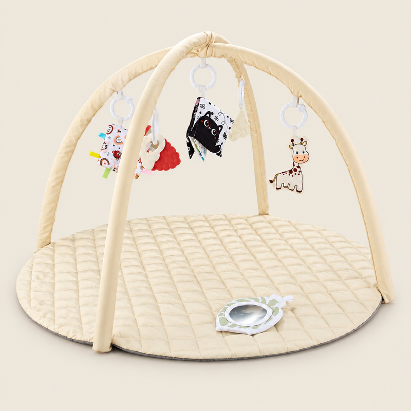 Soft Baby Activity Gym & Tummy Time Play Mat on warm neutral background